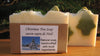 Christmas Tree Soap shows two fir trees buried in snow